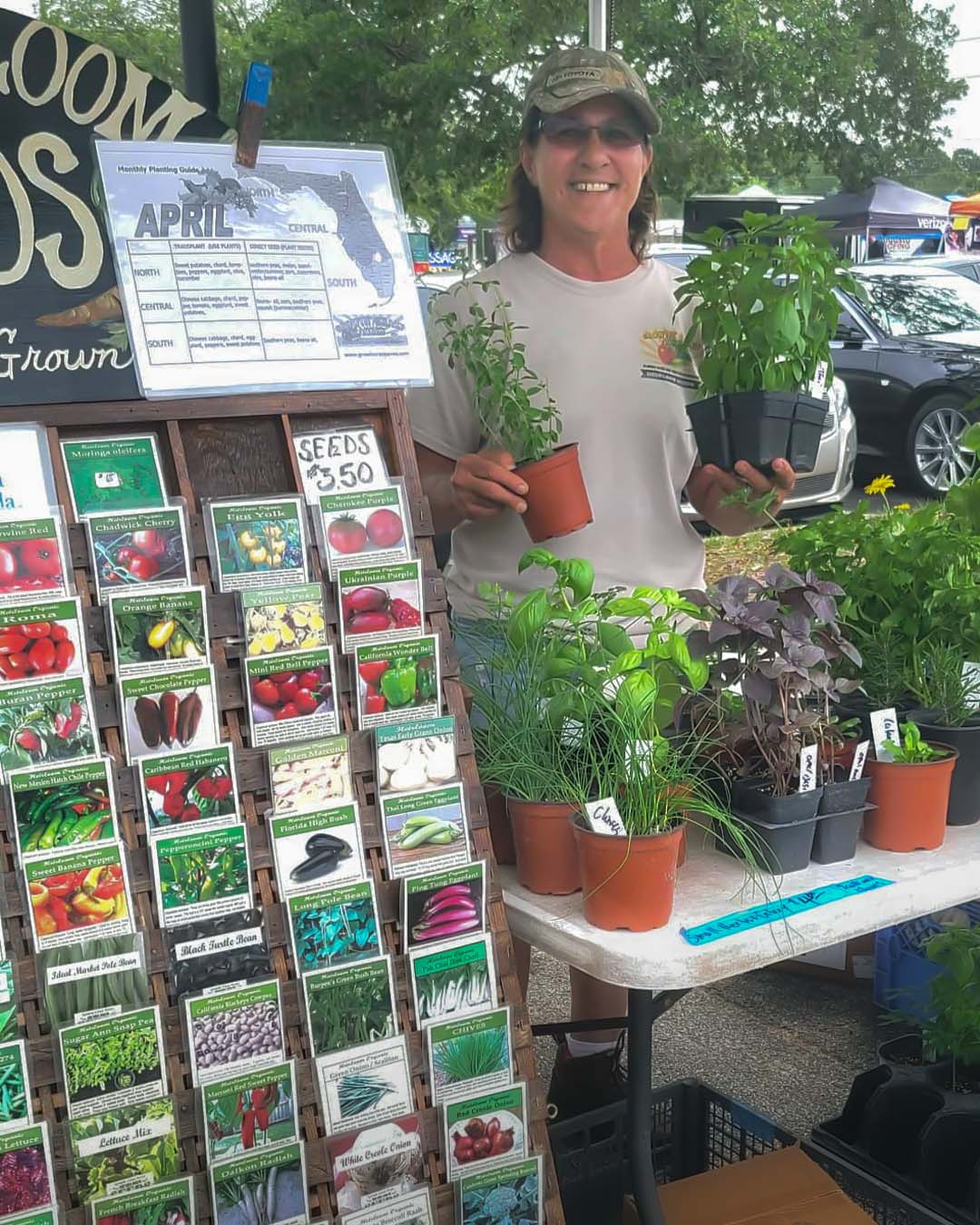 Desiree at Spring Hill Farmers Market with Heirloom seeds and plants